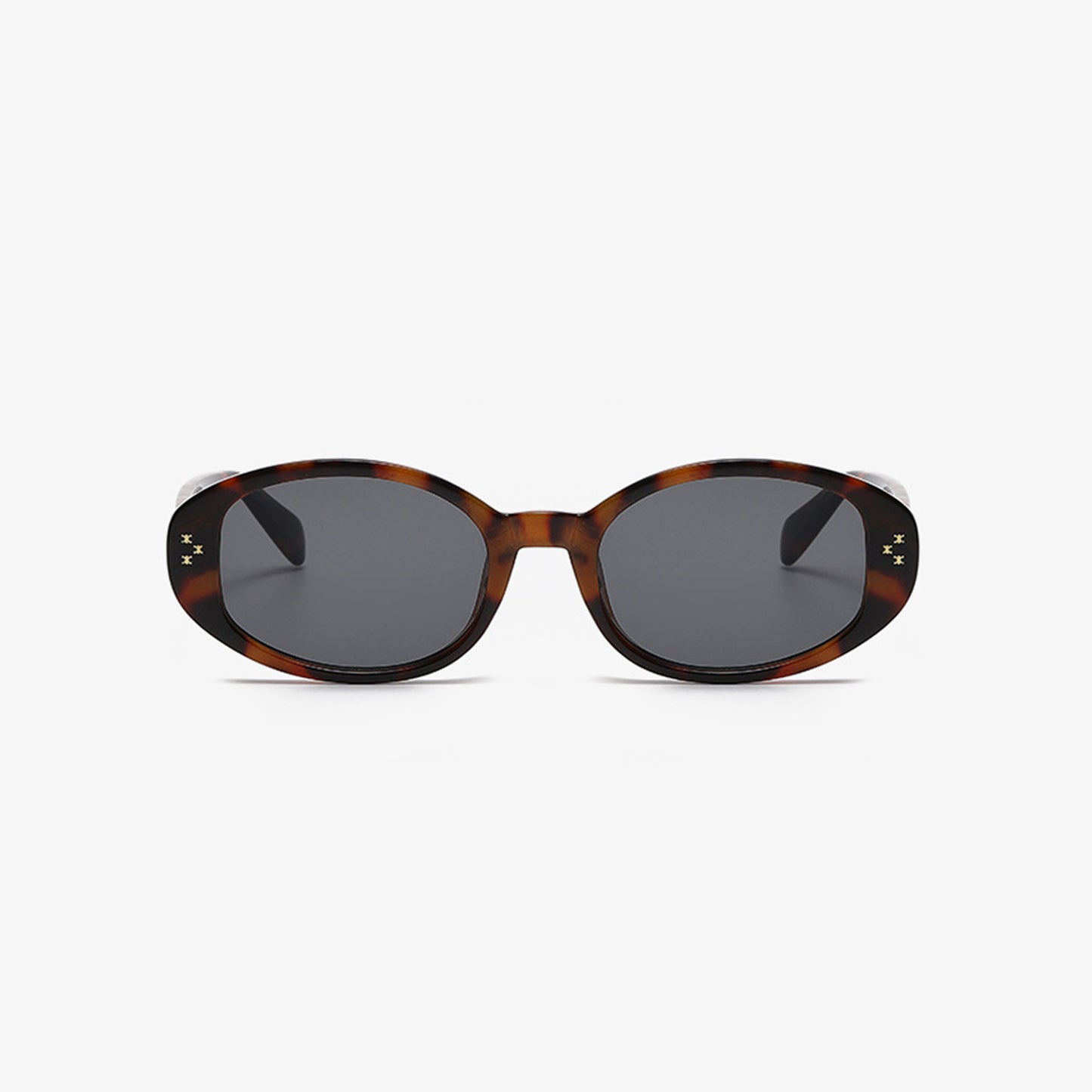 Introducing Marianela's Exclusive Shop, LLC’s Polycarbonate Frame Oval Sunglasses: This stylish pair boasts UV400 dark lenses bordered by a sophisticated tortoiseshell design. The polycarbonate frame features a subtle mottled brown pattern, while the straight temples have a slight curve at the ends for added comfort and elegance.