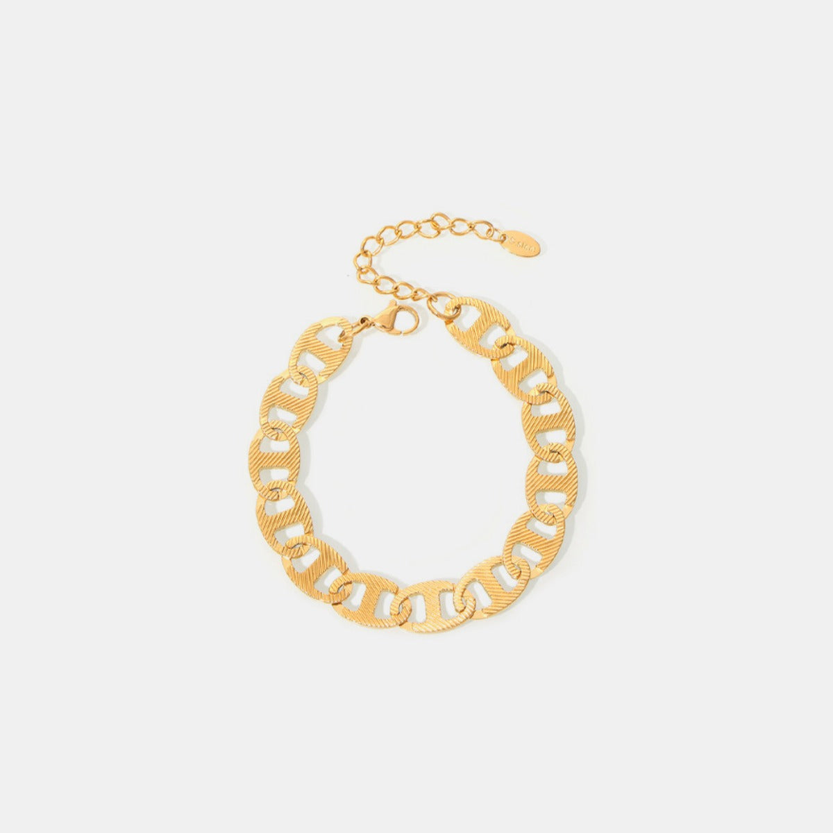 Marianela's Exclusive Shop presents the Luxe Gold Chain Bracelet, an 18K gold-plated piece featuring large, textured links and an adjustable clasp, beautifully showcased against a plain white background.