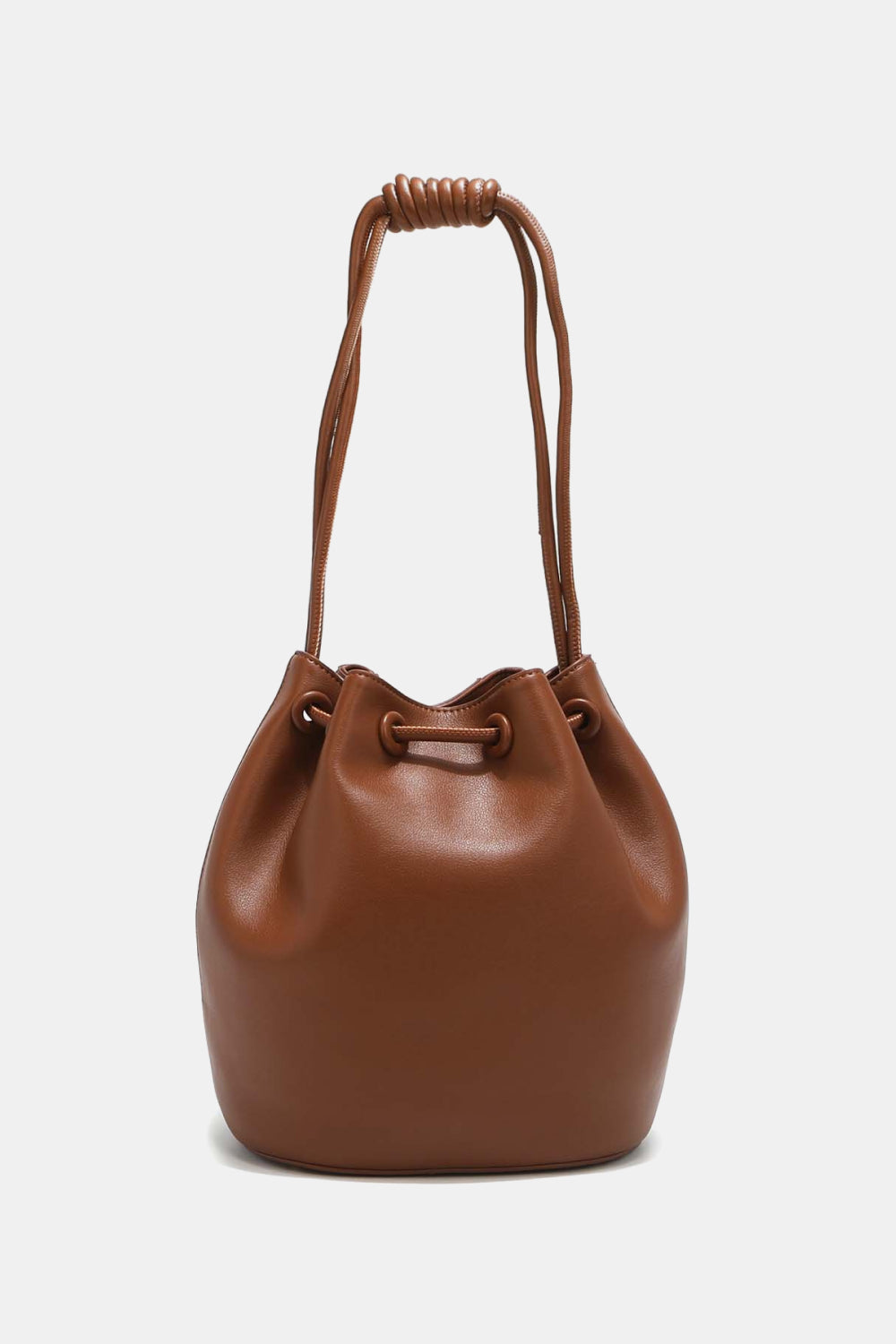 Introducing the Nicole Lee USA Amy Studded Bucket Bag from Marianela's Exclusive Shop, LLC – a brown pebbled vegan leather bucket bag featuring a drawstring and snap button closure, along with a knotted handle. This modern and stylish bag boasts a smooth texture and a rounded base. The drawstrings are tied into an elegant knot at the top, forming an easy-to-carry handle.