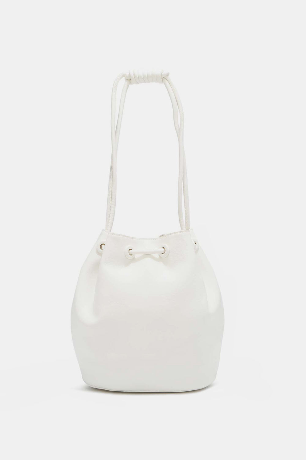 Introducing the Nicole Lee USA Amy Studded Bucket Bag from Marianela's Exclusive Shop, LLC, a minimalist white bucket bag made from pebbled vegan leather with a soft, rounded shape. It features a drawstring and snap button closure at the top and two rope handles. The bag boasts a smooth, clean finish with no visible branding or additional adornments.