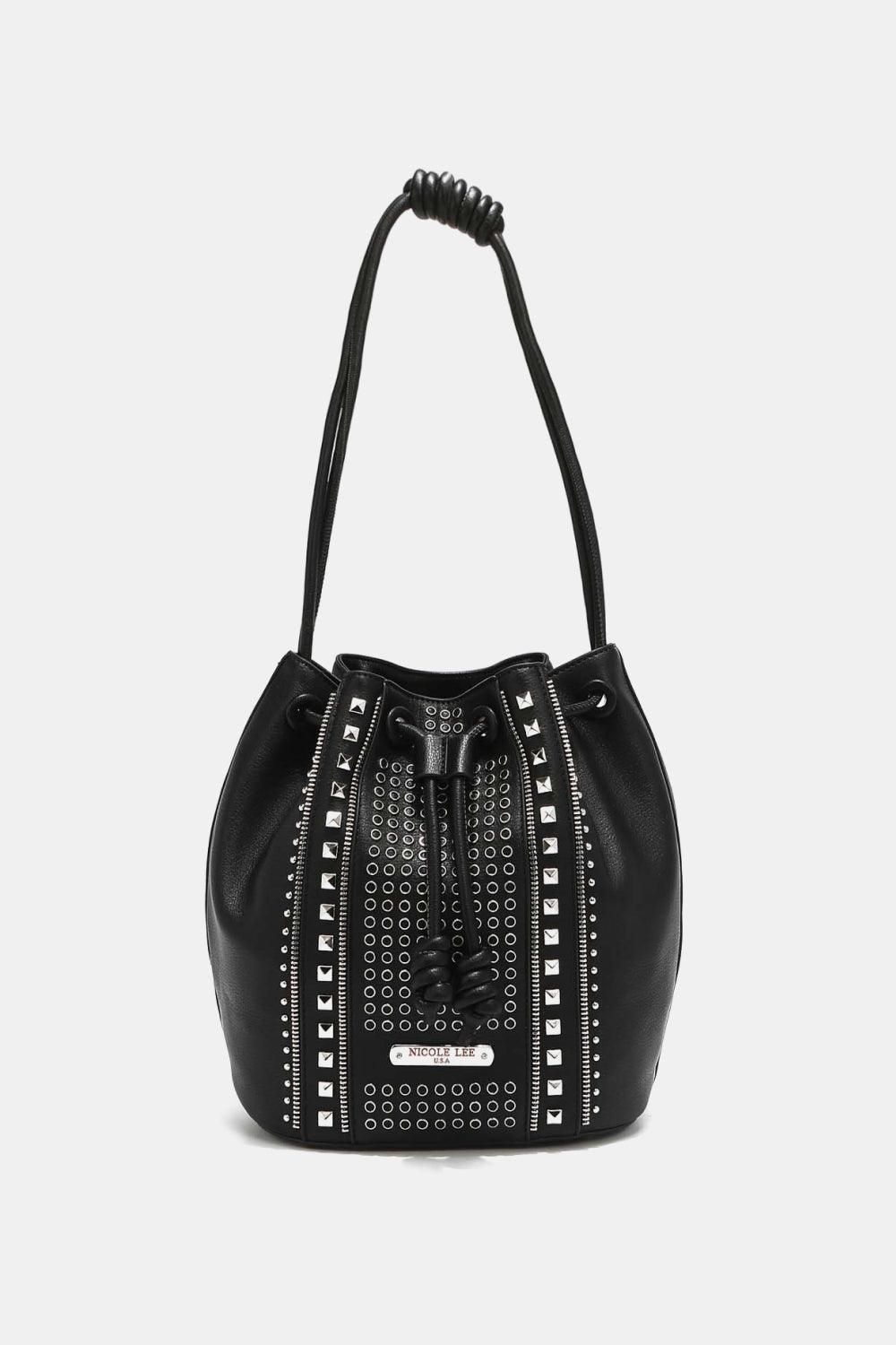 The Nicole Lee USA Amy Studded Bucket Bag from Marianela's Exclusive Shop, LLC is a stylish bucket bag crafted from pebbled vegan leather. It features a drawstring and snap button closure, with silver eyelets and stud detailing for a trendy touch. The black bag includes a single shoulder strap with a knotted design. The background is plain white.