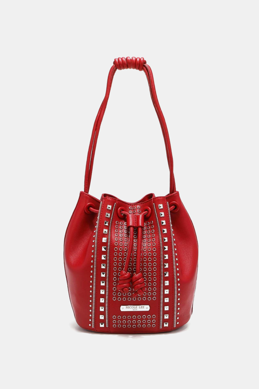 Introducing the Nicole Lee USA Amy Studded Bucket Bag from Marianela's Exclusive Shop, LLC: A red pebbled vegan leather bucket bag adorned with metallic eyelet and stud detailing. It features a secure drawstring closure with tassels and a braided shoulder strap, all in matching red. This bag boasts a modern and stylish design.